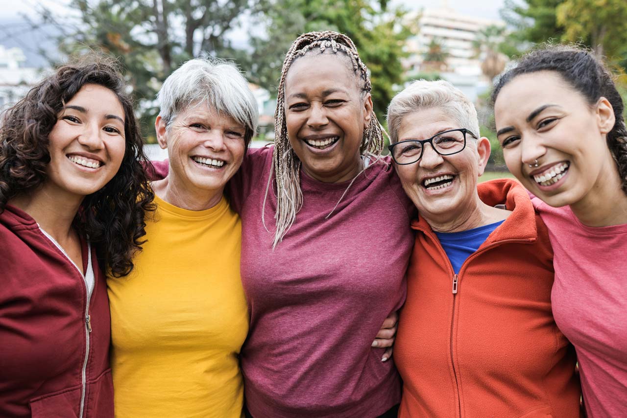 image of women smiling and supporting each other